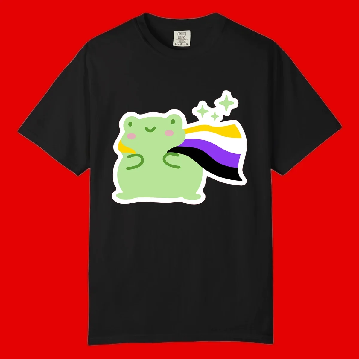 Cute green frog with pink cheeks wearing a yellow, purple, and black rainbow cape with floating sparkle stars