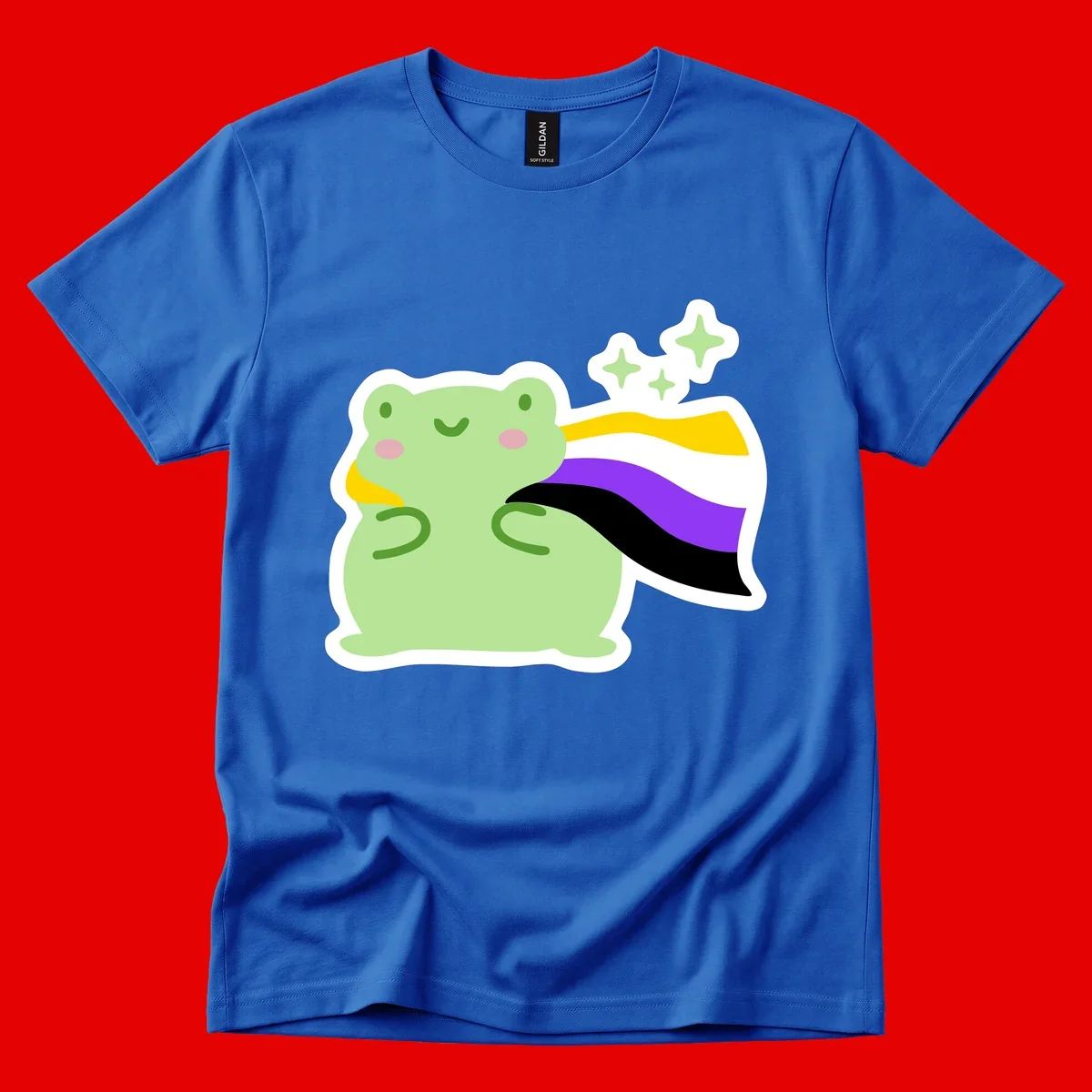 Cute green frog with pink cheeks wearing a yellow, purple, and black rainbow cape with floating sparkle stars