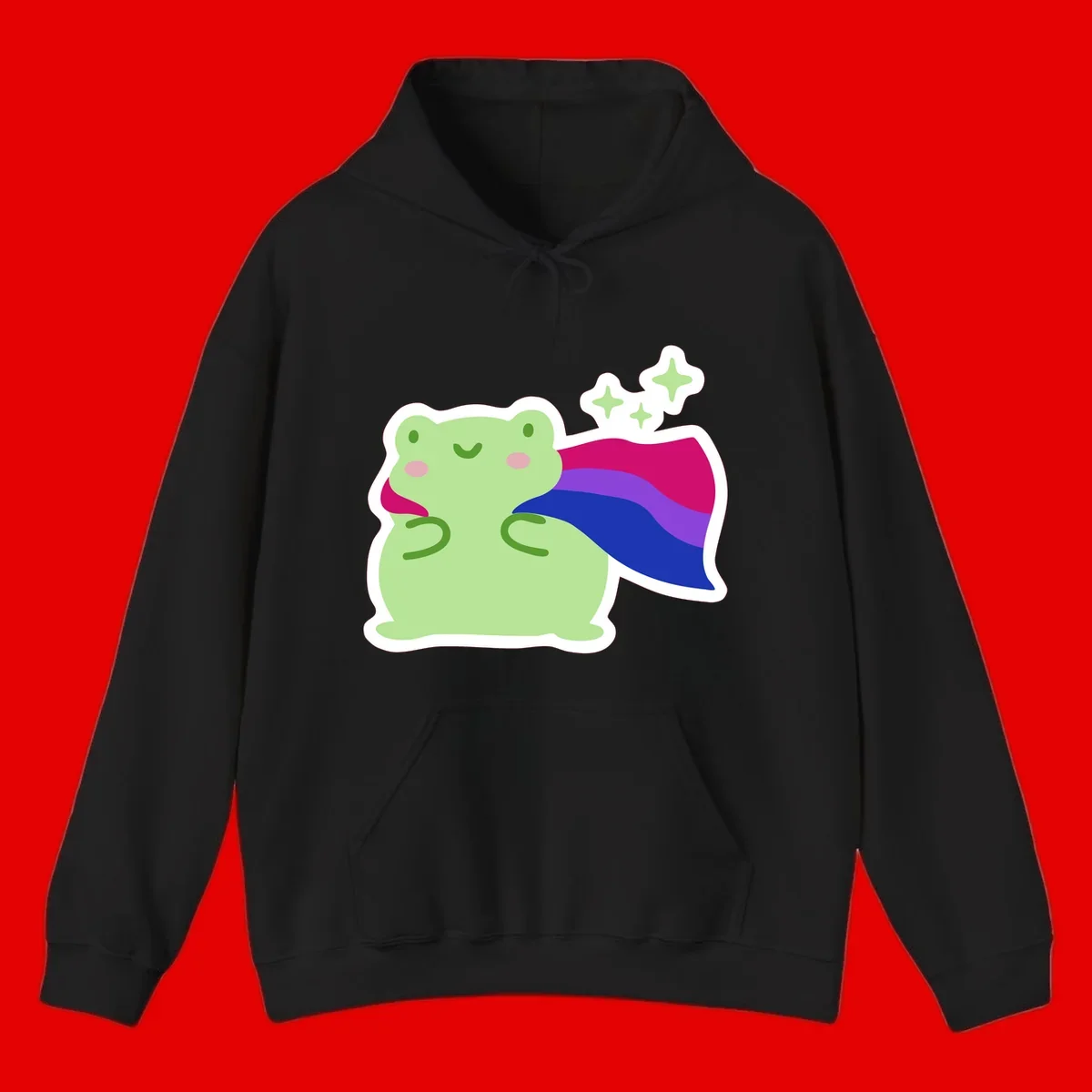 Smiling green frog wearing a flowing rainbow cape with floating sparkles, pride-frog-cape design illustration