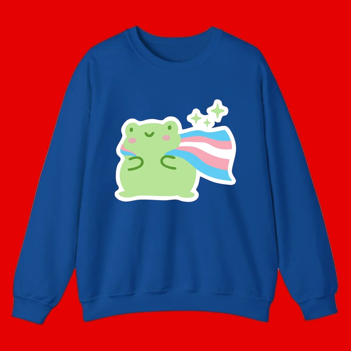 Cheerful green frog with sparkles wearing a magical pink and blue striped cape