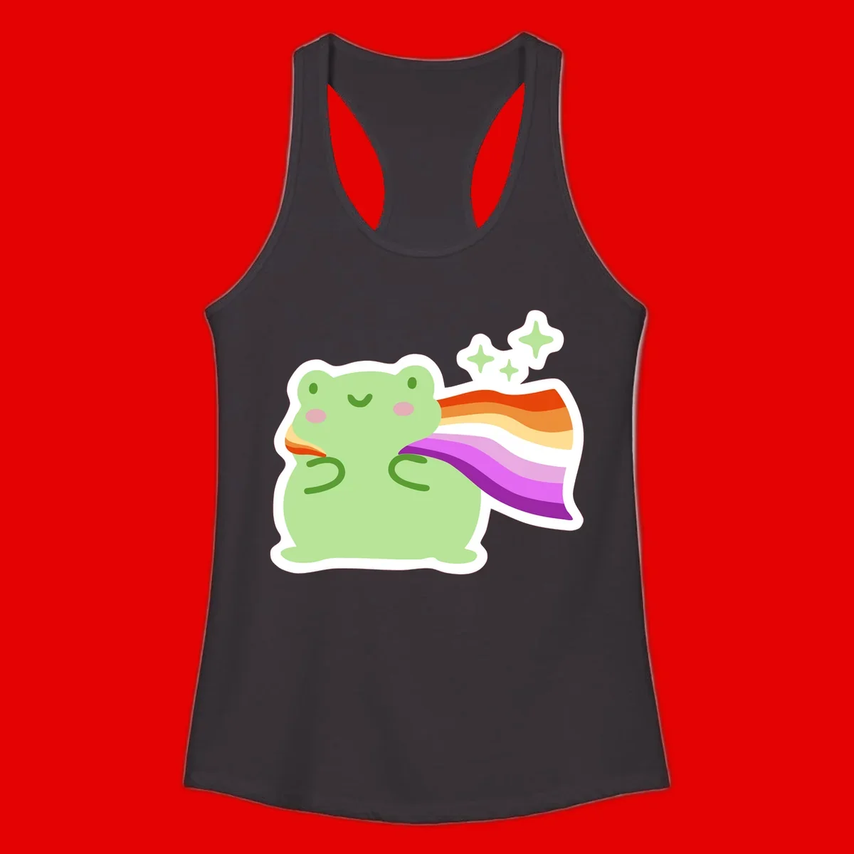 Cute green frog with pink cheeks wearing a rainbow pride cape, surrounded by sparkle stars
