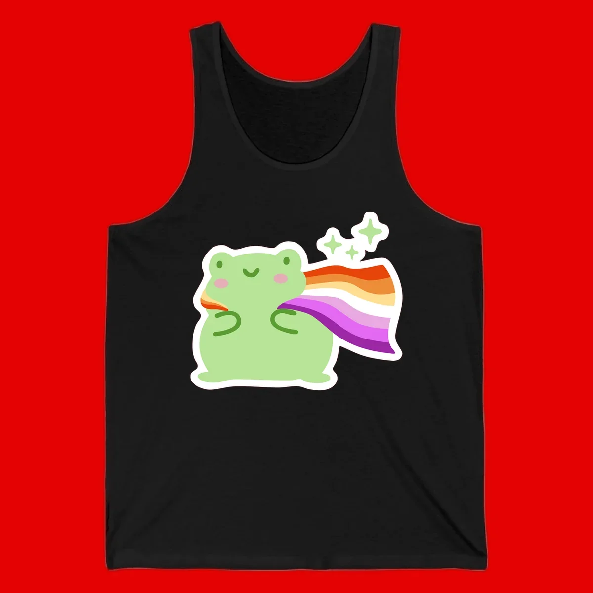 Cute green frog with pink cheeks wearing a rainbow pride cape, surrounded by sparkle stars