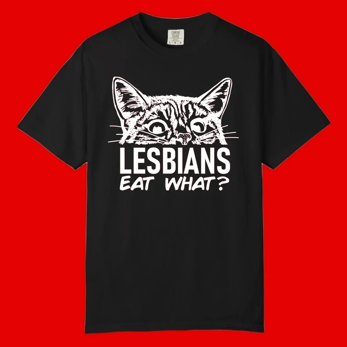 Lesbians eat what cat design: Detailed line-art cat face with expressive eyes and whiskers above bold text reading 'LESBIANS EAT WHAT?'