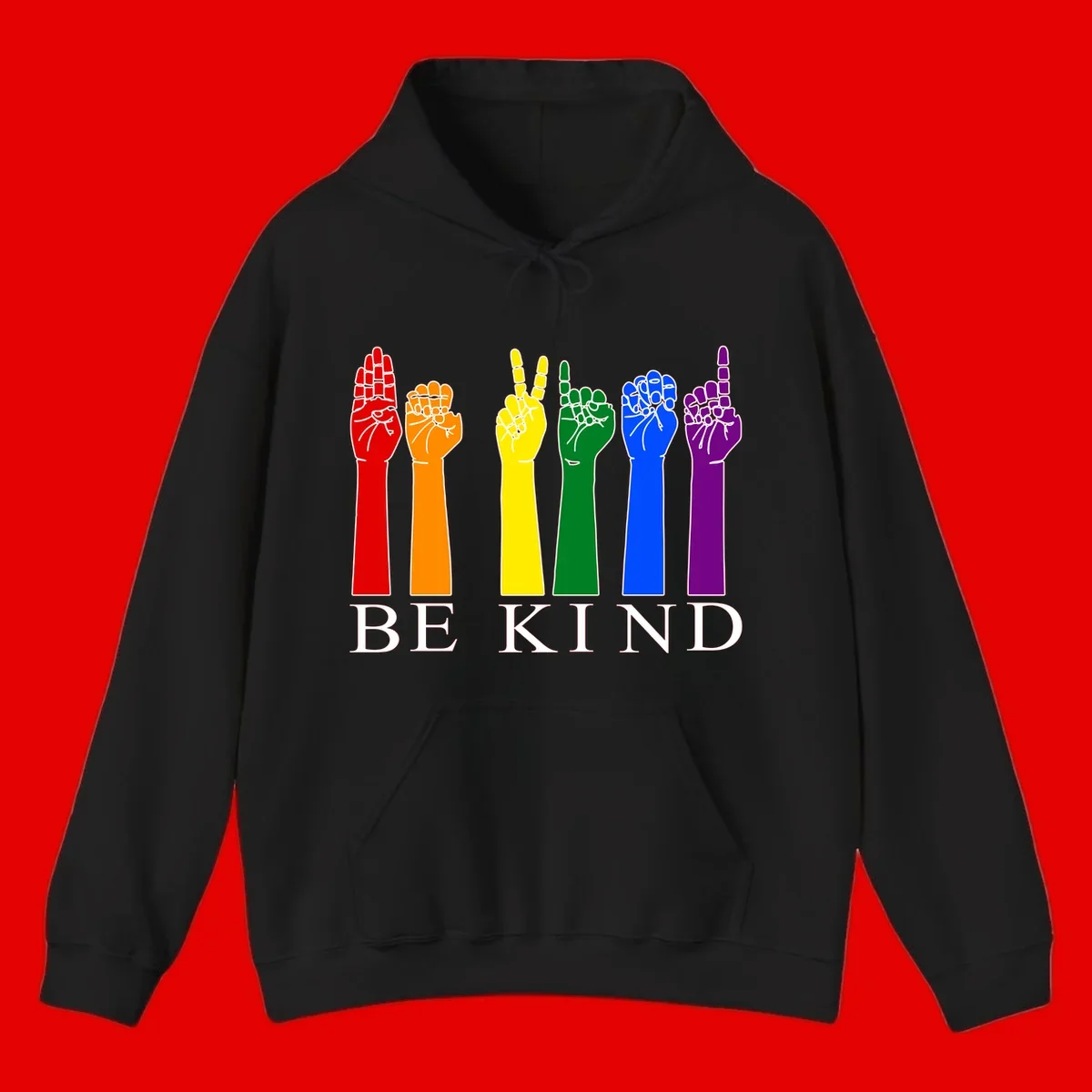 Six rainbow-colored raised hands in red, orange, yellow, green, blue, and purple with white line details and 'BE KIND' text below
