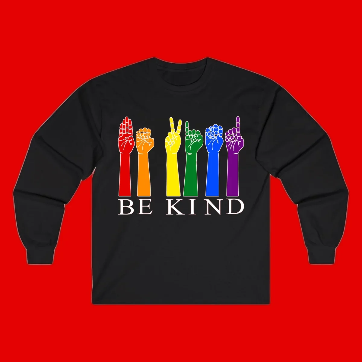 Six rainbow-colored raised hands in red, orange, yellow, green, blue, and purple with white line details and 'BE KIND' text below