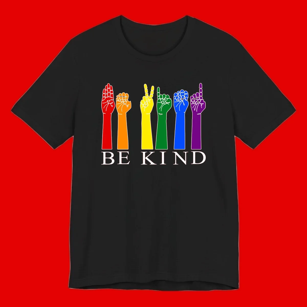 Six rainbow-colored raised hands in red, orange, yellow, green, blue, and purple with white line details and 'BE KIND' text below