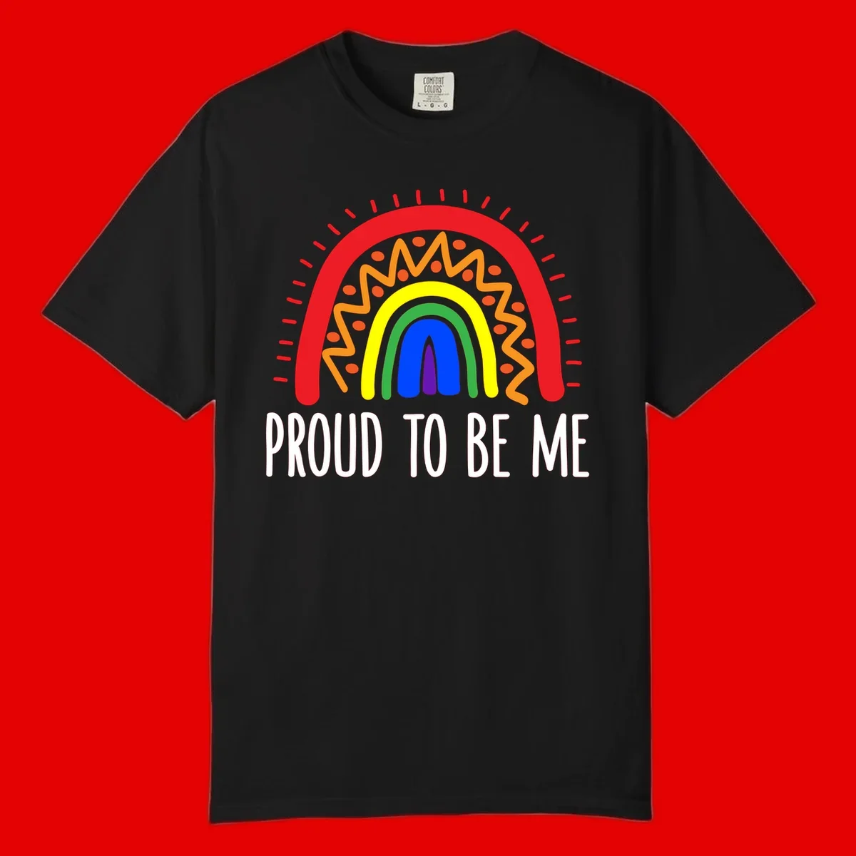 Colorful concentric rainbow arcs with radiating lines and zigzag patterns surrounding text that reads 'Proud To Be Me'