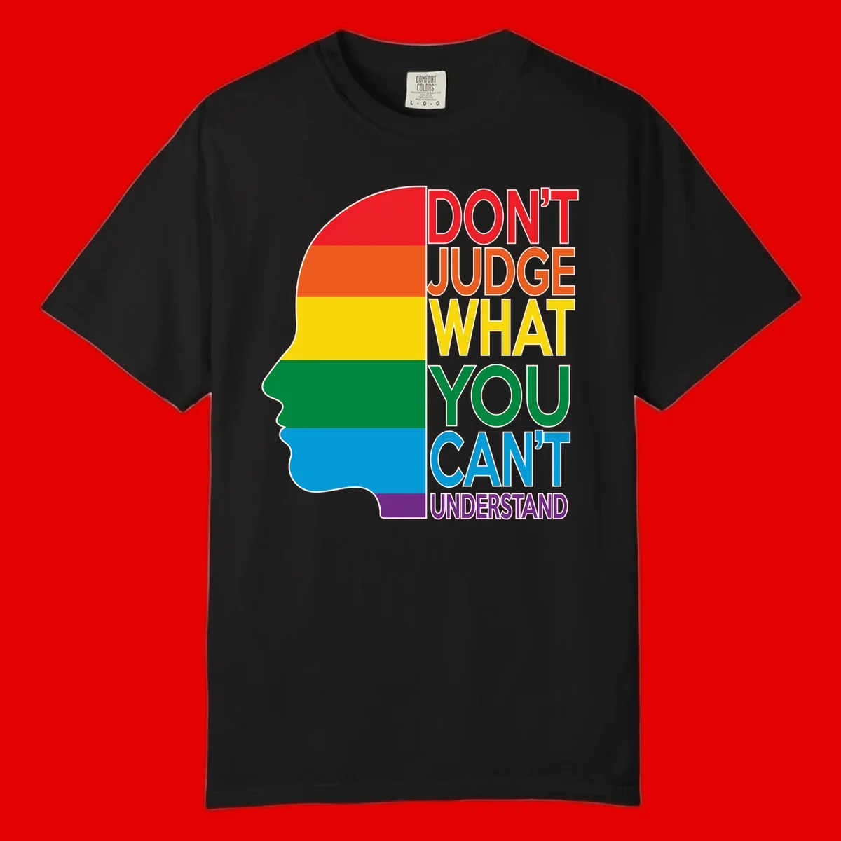 Rainbow-striped head silhouette with text 'Don't Judge What You Can't Understand' promoting LGBTQ acceptance and inclusion