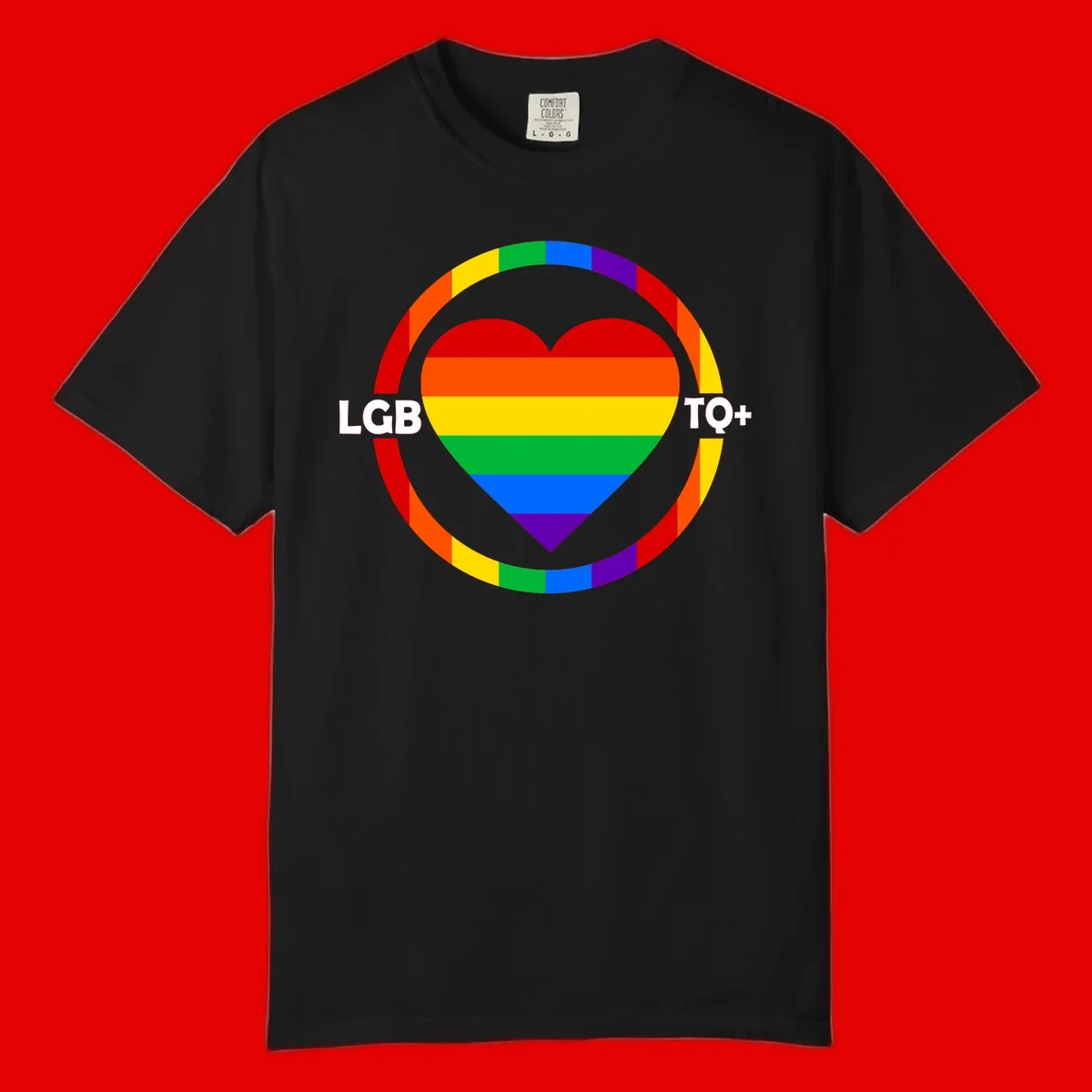 Rainbow heart with LGB TO+ text in concentric pride circles on gray background