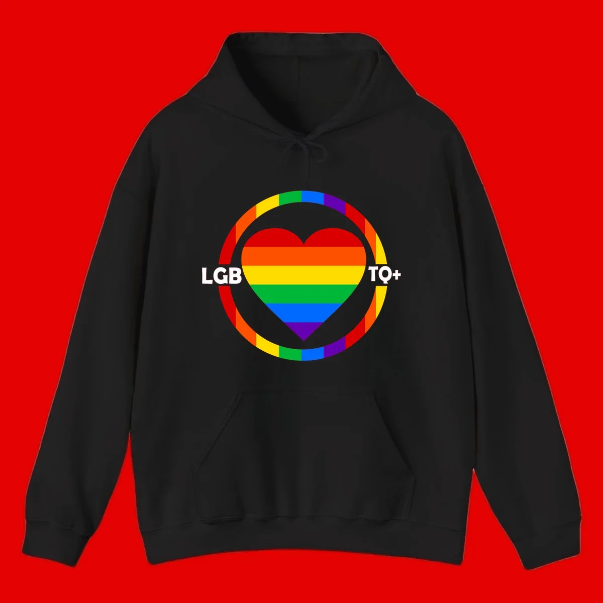 Rainbow heart with LGB TO+ text in concentric pride circles on gray background