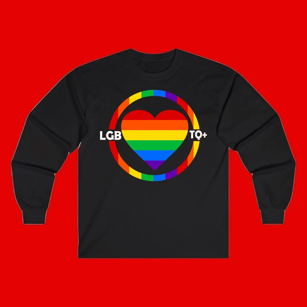 Rainbow heart with LGB TO+ text in concentric pride circles on gray background