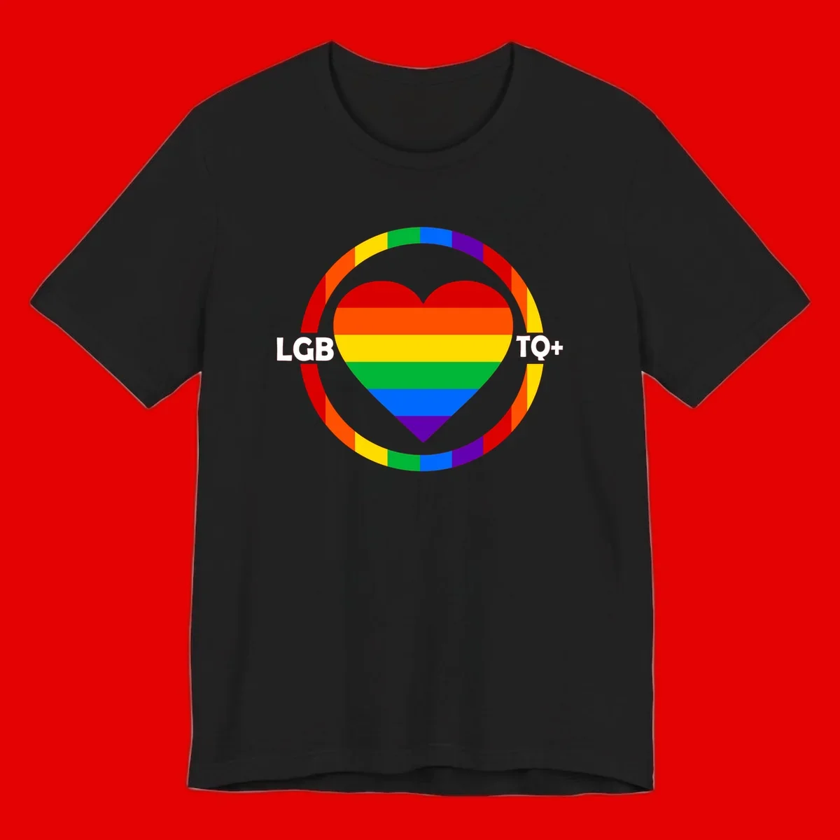 Rainbow heart with LGB TO+ text in concentric pride circles on gray background