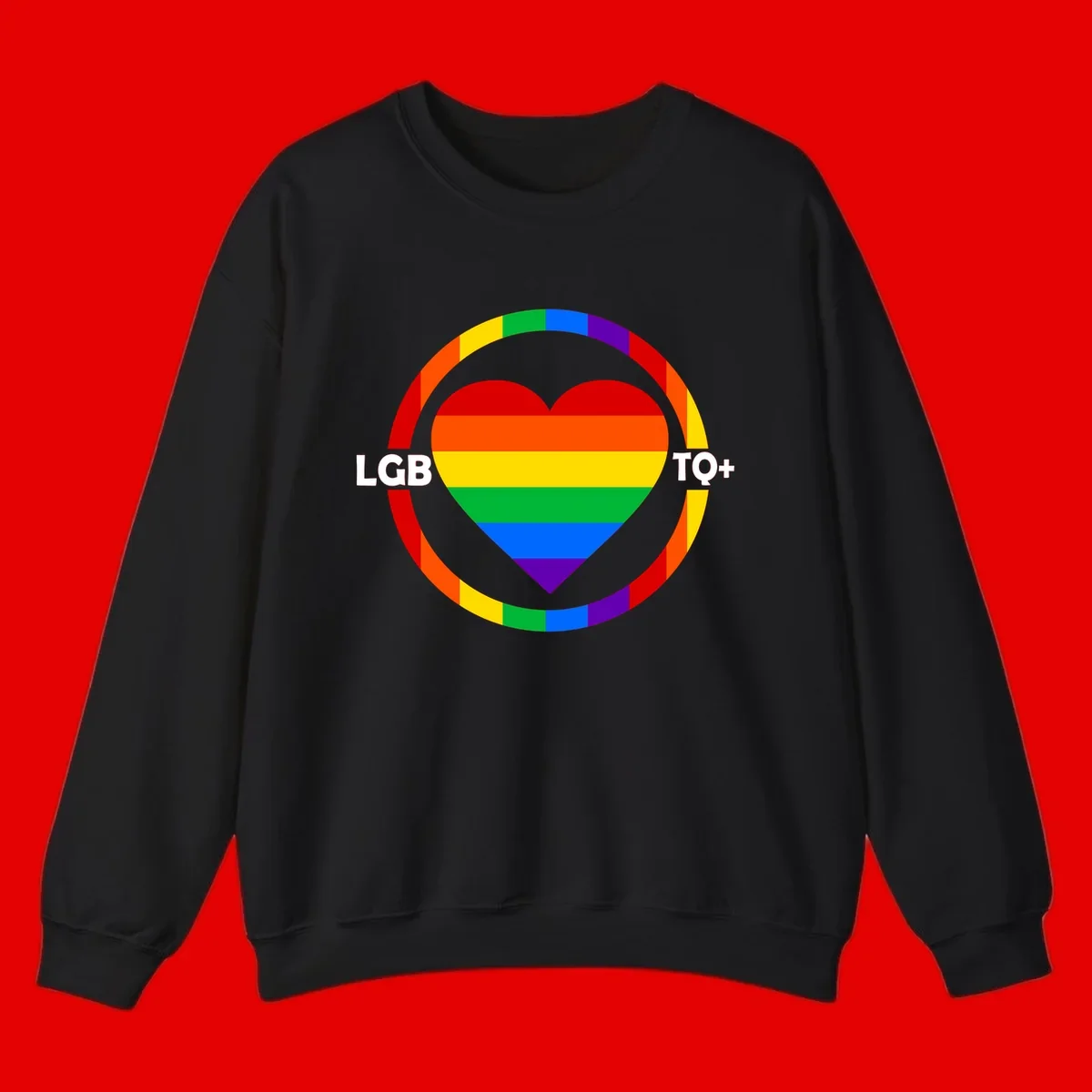 Rainbow heart with LGB TO+ text in concentric pride circles on gray background