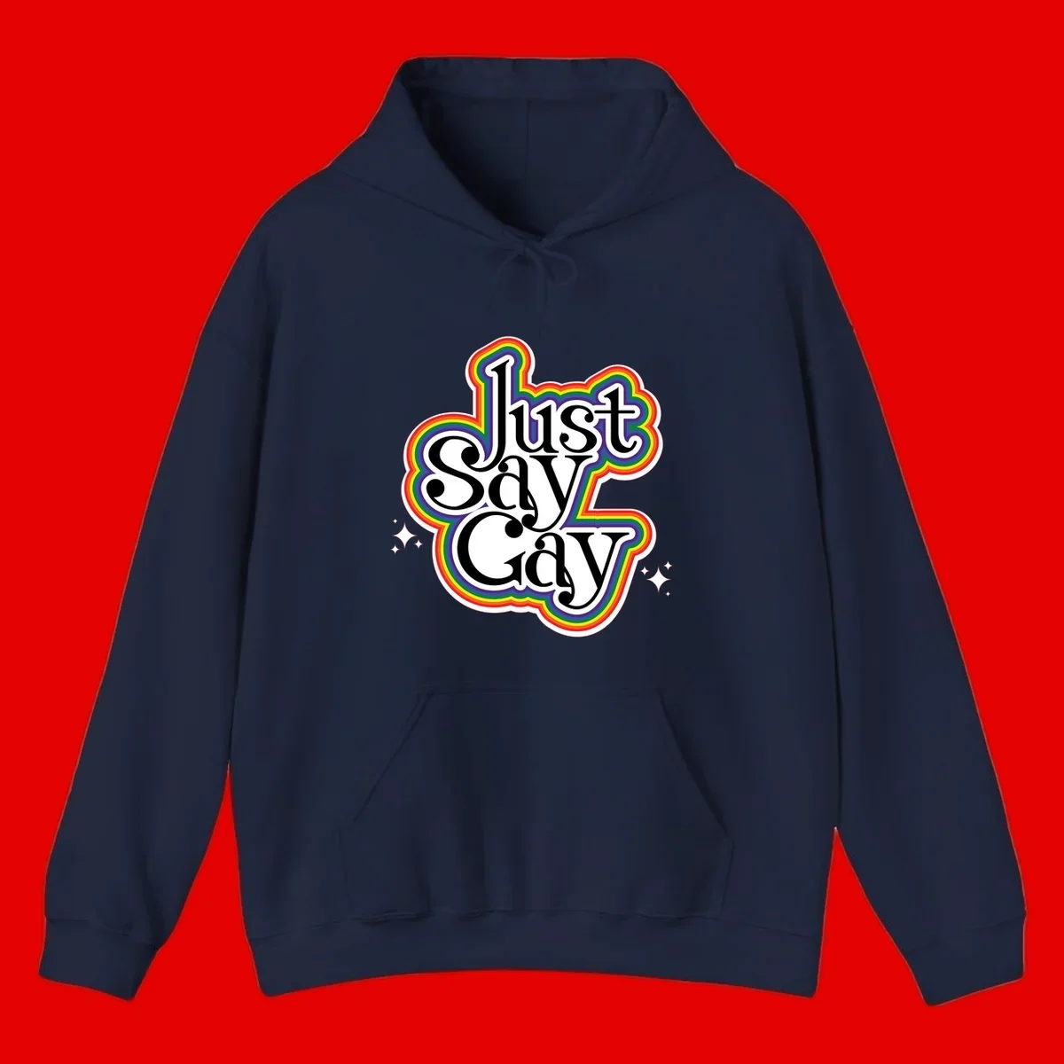 Just Say Gay Pride design with bold black text surrounded by vibrant rainbow border and sparkle accents on gray background