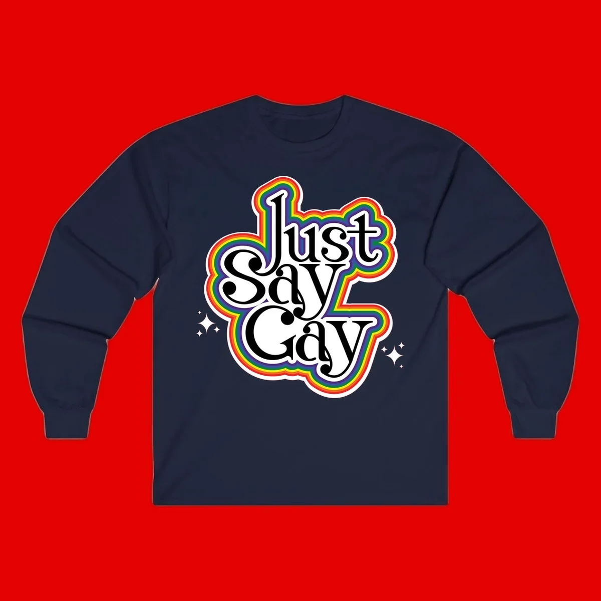Just Say Gay Pride design with bold black text surrounded by vibrant rainbow border and sparkle accents on gray background