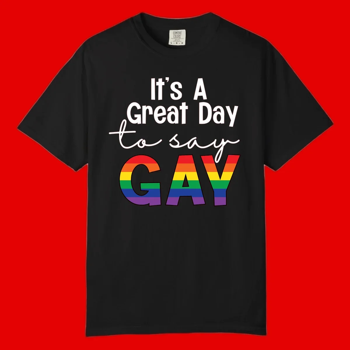 Gray background with white text reading 'It's A Great Day To Say' and the word 'GAY' in large letters filled with rainbow pride flag stripes