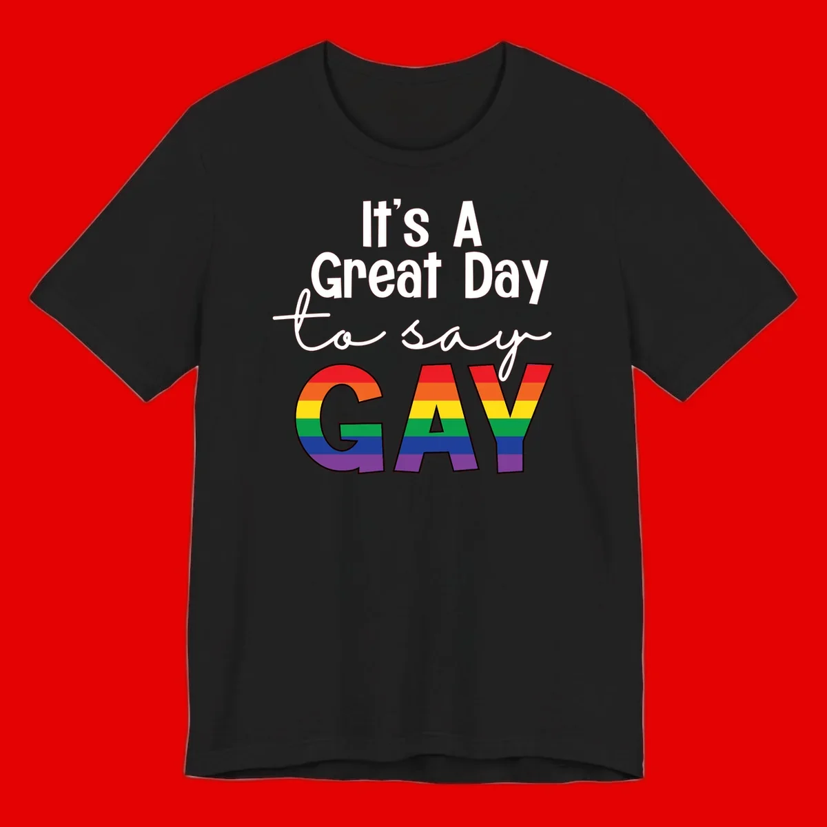 Gray background with white text reading 'It's A Great Day To Say' and the word 'GAY' in large letters filled with rainbow pride flag stripes