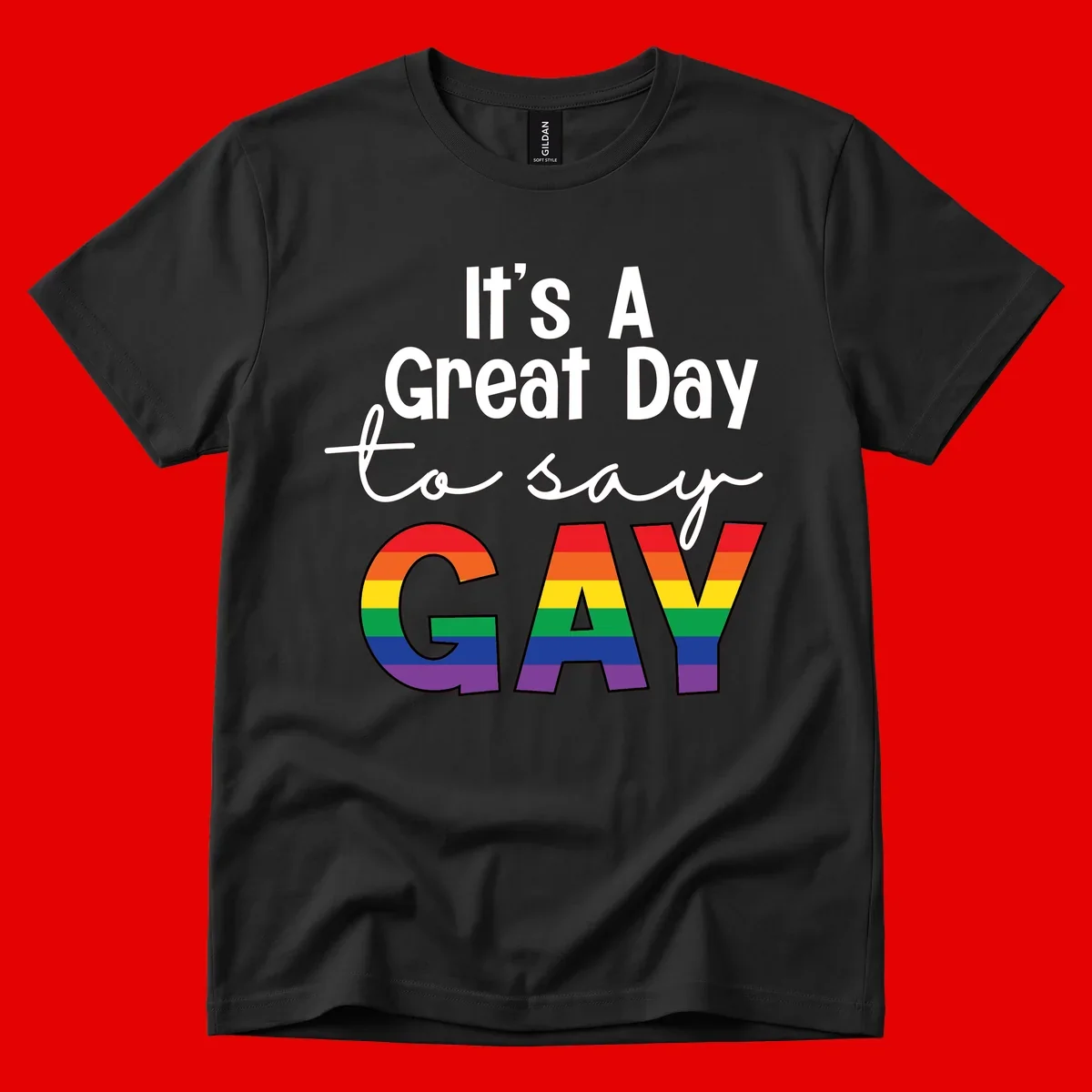 Gray background with white text reading 'It's A Great Day To Say' and the word 'GAY' in large letters filled with rainbow pride flag stripes