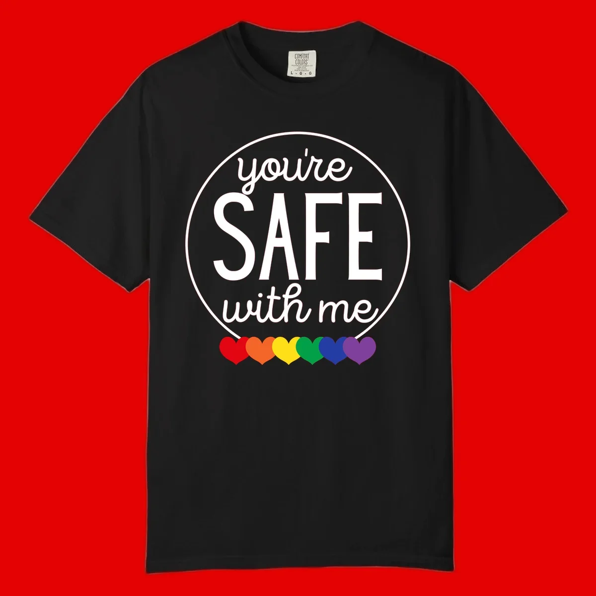Circular badge with 'you're SAFE with me' text and rainbow pride hearts, promoting inclusive safe space message