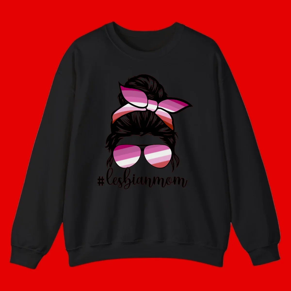 Illustration of a woman with black hair, pink bow, and aviator sunglasses featuring lesbian pride flag stripes with #lesbianmom text