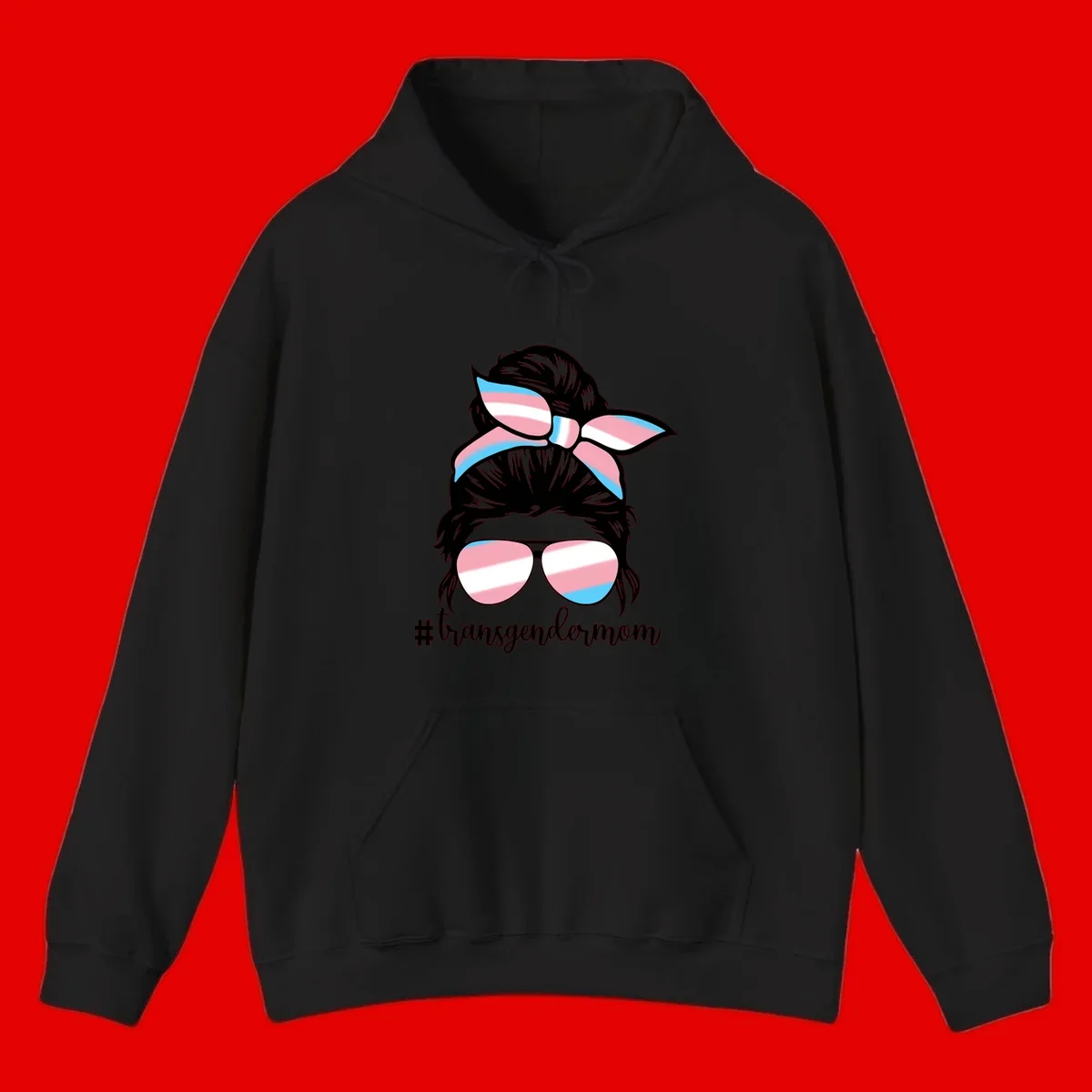 Stylized portrait with black hair, cat-eye sunglasses and bow in transgender flag colors, #transgendermom text below