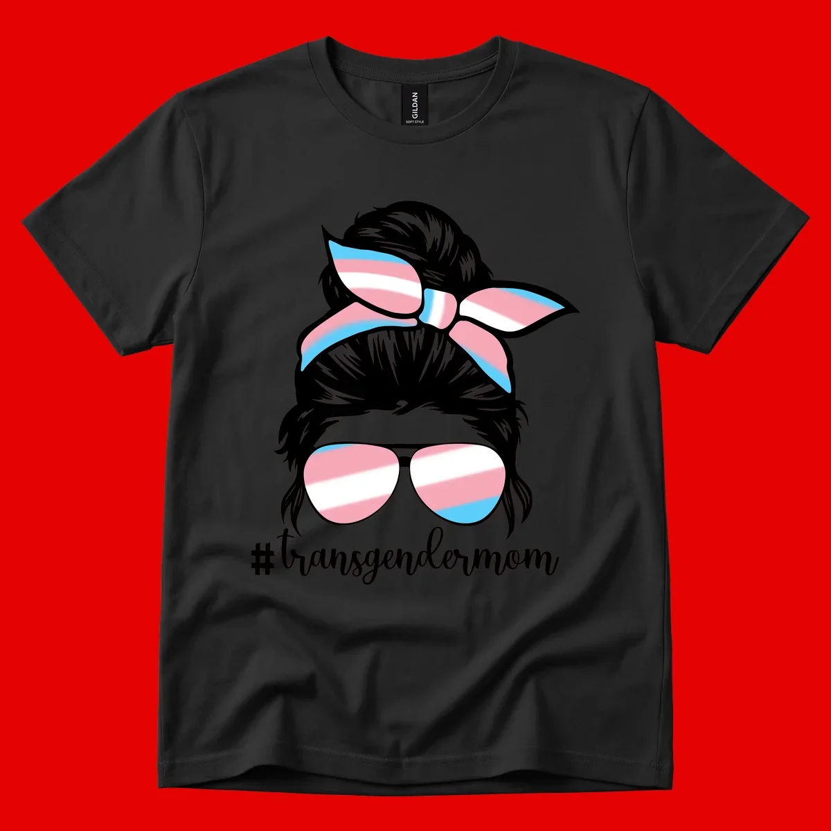 Stylized portrait with black hair, cat-eye sunglasses and bow in transgender flag colors, #transgendermom text below