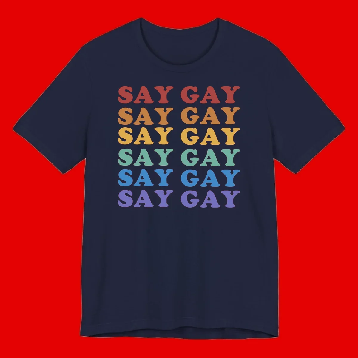 Repeating 'SAY GAY' text in rainbow colors from red to purple on gray background, pride statement design