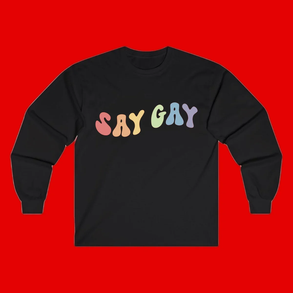 Colorful bubble letters spelling SAY GAY in rainbow pride colors: red, peach, yellow, green, blue, and purple on gray background
