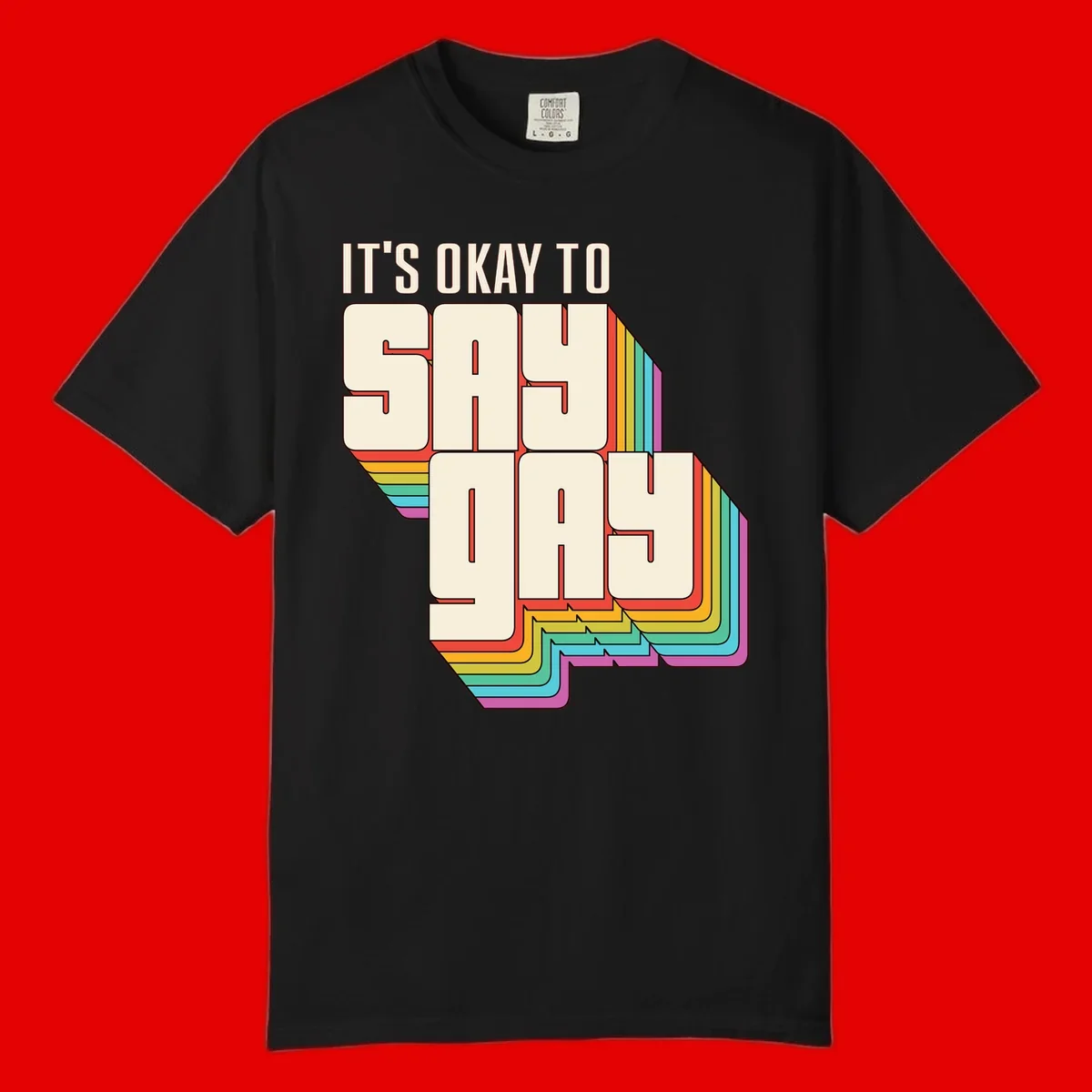 3D block letter design reading 'It's Okay To Sigh Out Loud' with rainbow-colored layered borders and pride flag stripes