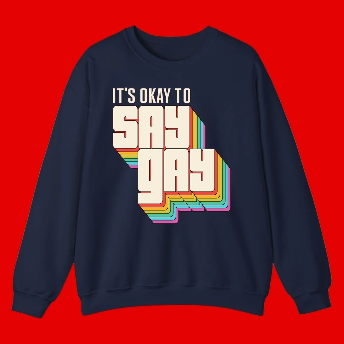 3D block letter design reading 'It's Okay To Sigh Out Loud' with rainbow-colored layered borders and pride flag stripes
