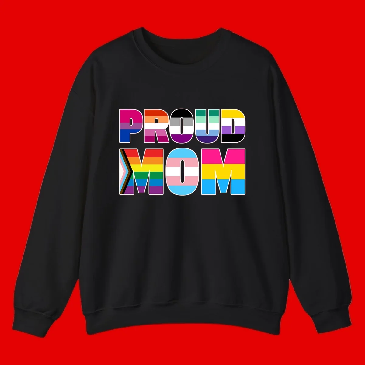 Colorful 'PROUD' letters filled with various pride flags including rainbow, trans, progress pride, and intersex symbols on gray background