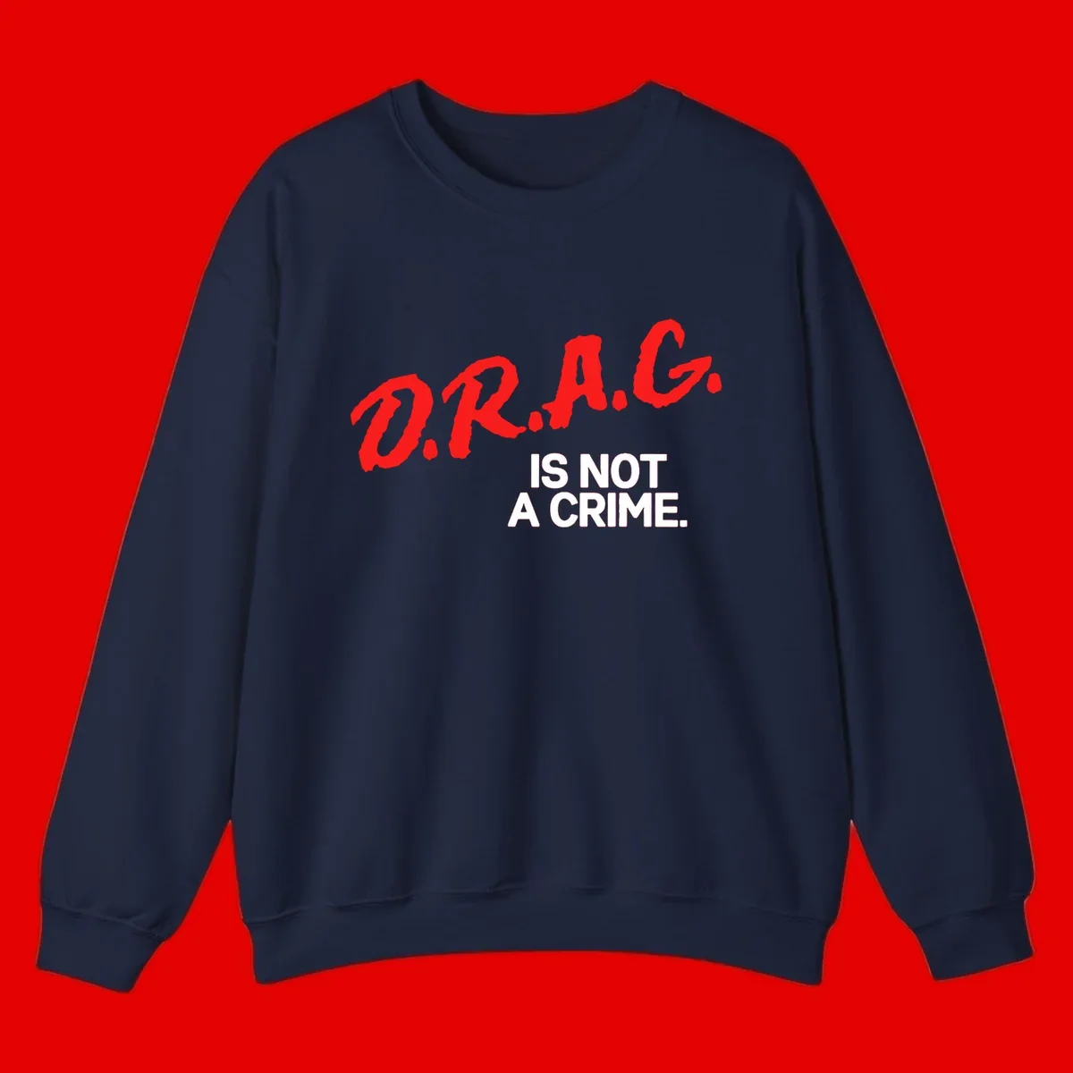 Red hand-drawn lettering spelling 'D.R.A.G.' with white text reading 'IS NOT A CRIME' on gray background