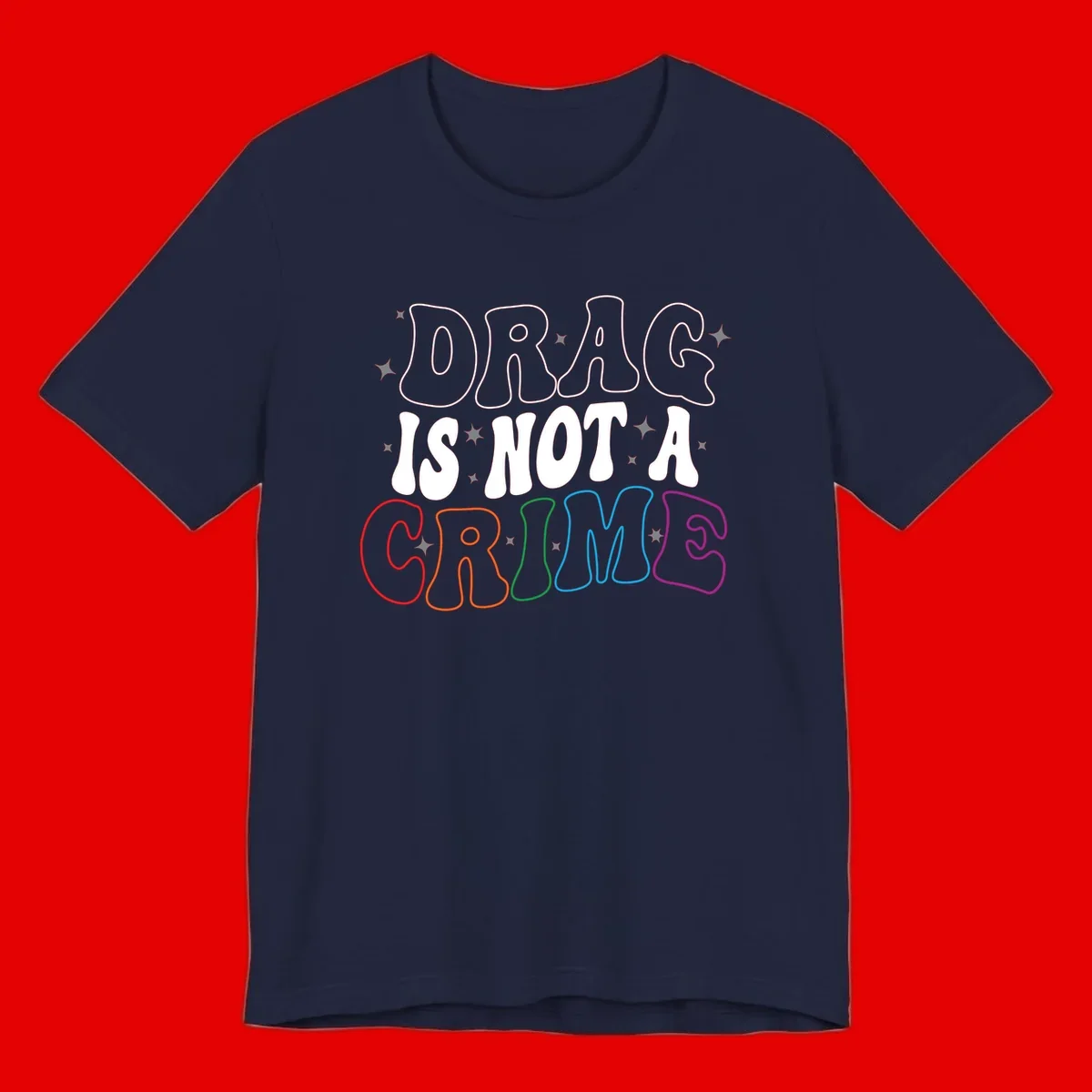 Drag is not a crime design with white and rainbow-colored outlined text on gray background