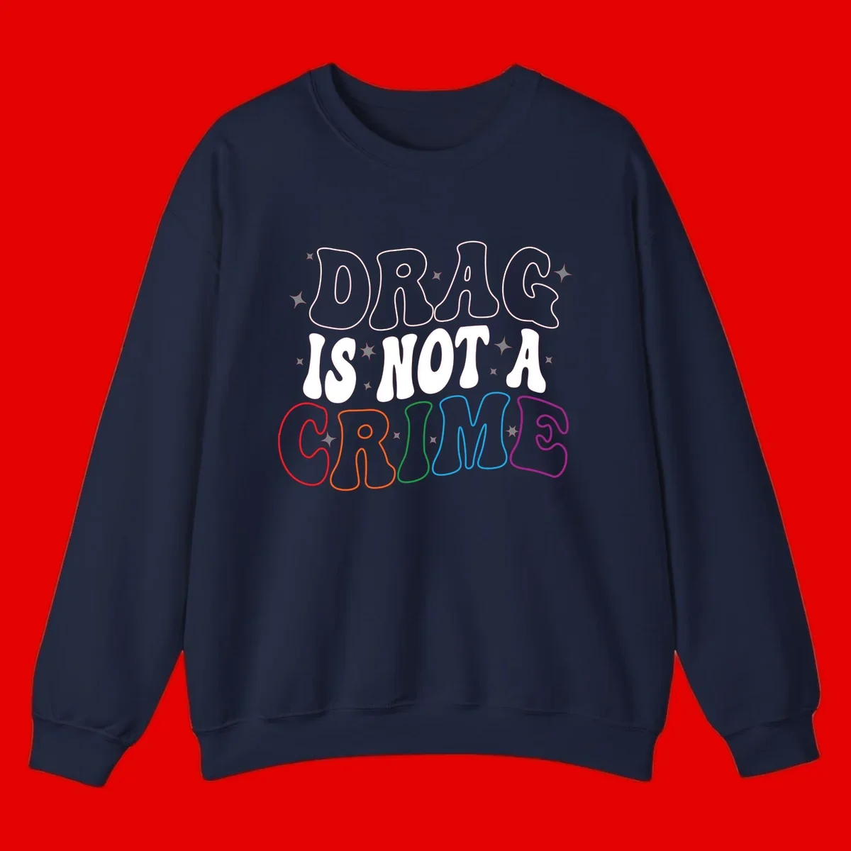 Drag is not a crime design with white and rainbow-colored outlined text on gray background