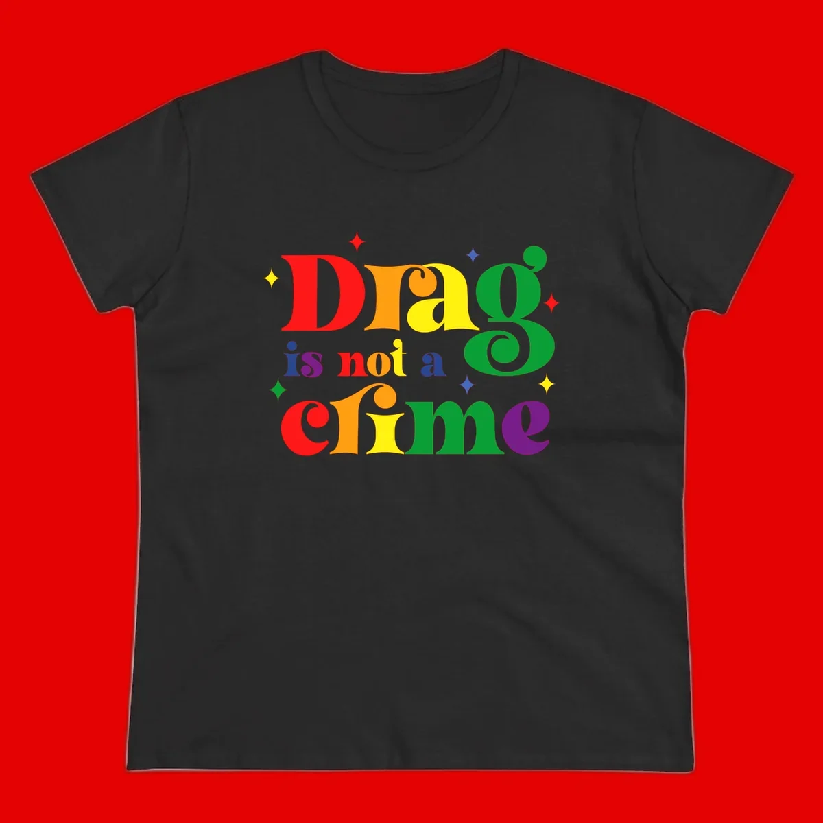 Colorful rainbow typography spelling 'Drag is not a crime' with decorative stars on gray background