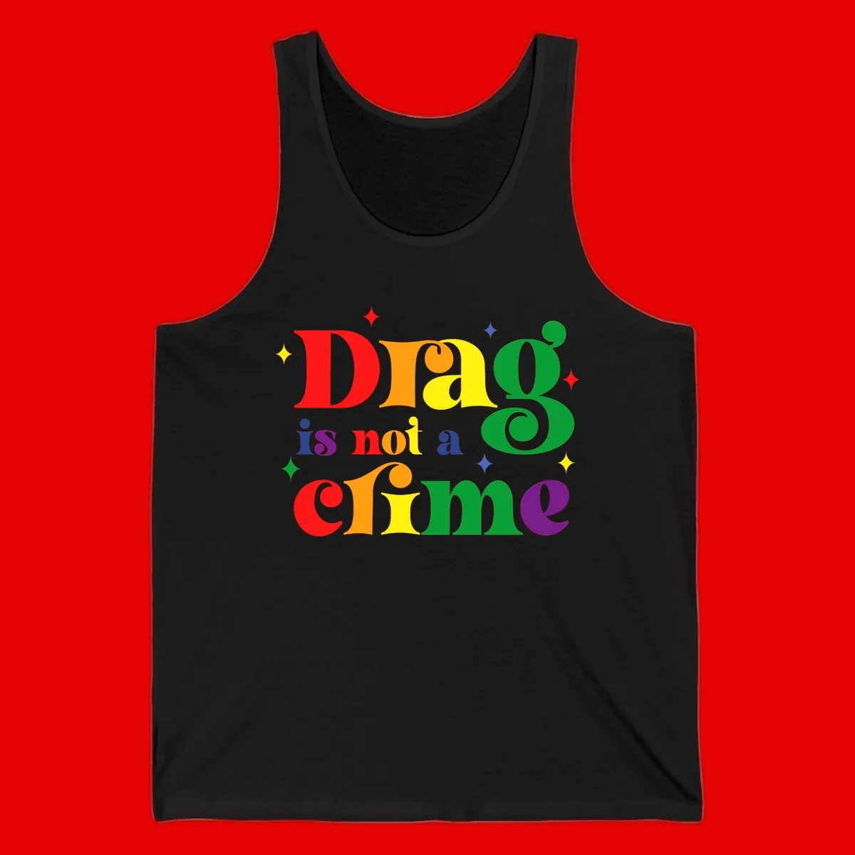 Colorful rainbow typography spelling 'Drag is not a crime' with decorative stars on gray background
