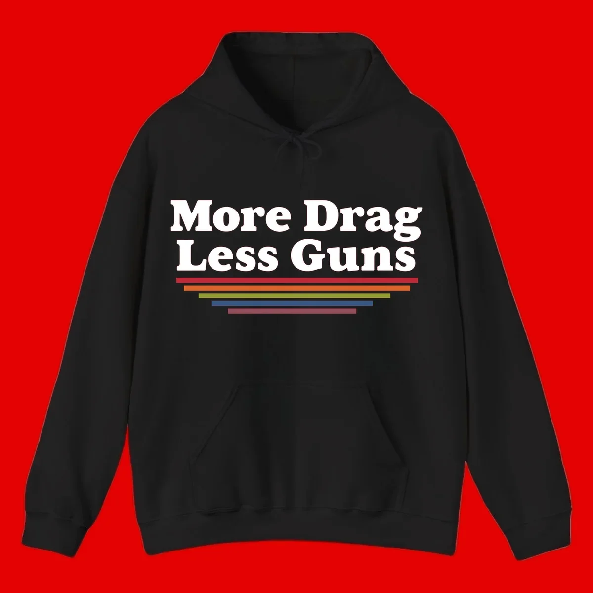 More Drag Less Guns design: white text on gray background with colored horizontal bars representing pride and activism