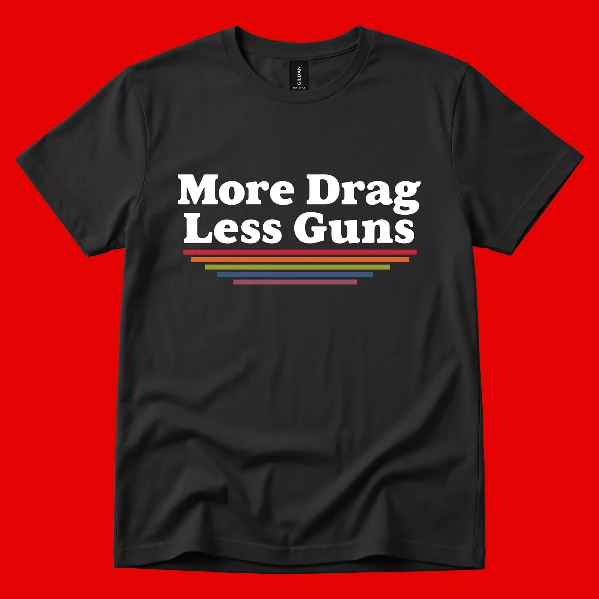 More Drag Less Guns design: white text on gray background with colored horizontal bars representing pride and activism