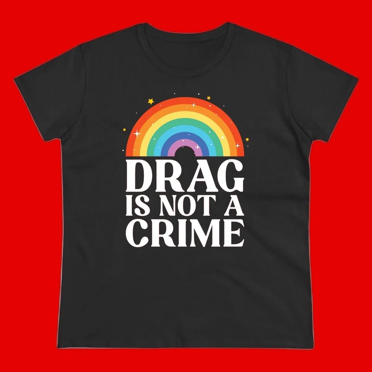 Colorful rainbow arc with stars above white text reading 'Drag Is Not A Crime' on gray background