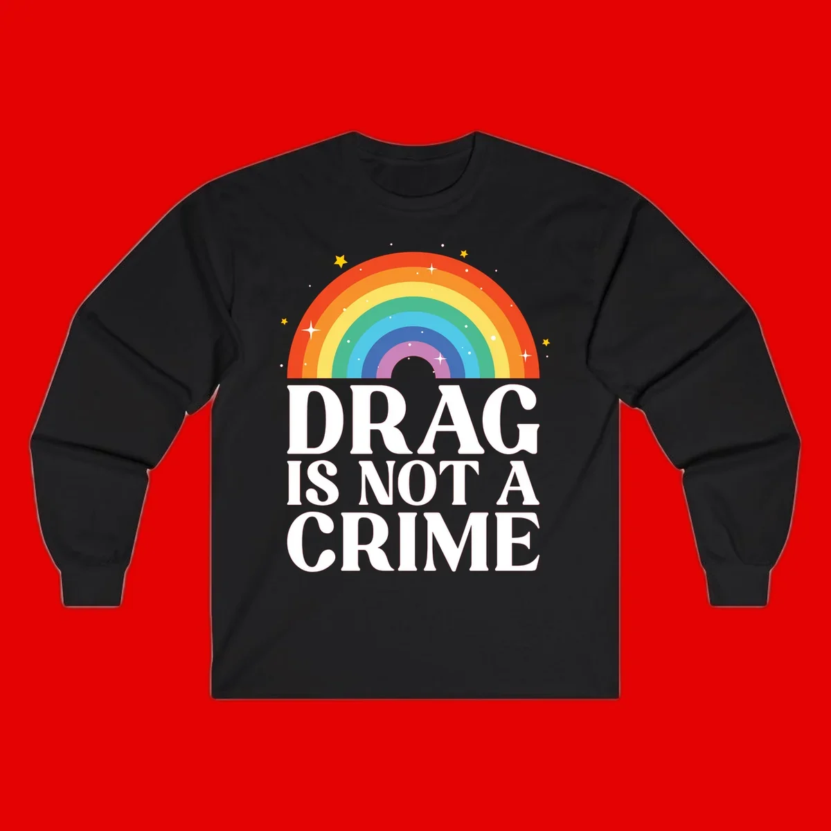 Colorful rainbow arc with stars above white text reading 'Drag Is Not A Crime' on gray background