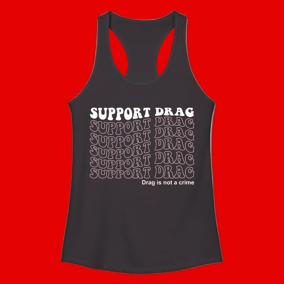 Gray t-shirt design with white text reading 'Support Drag' repeated throughout and 'Drag is not a crime' at bottom