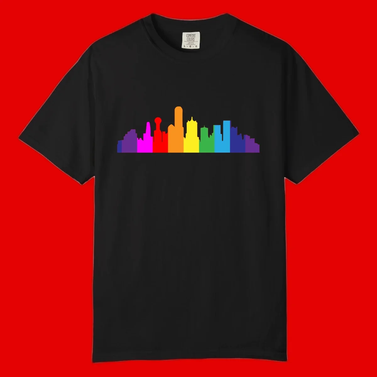 Colorful city skyline silhouette in rainbow pride colors transitioning from purple through red, orange, yellow, green, cyan and blue