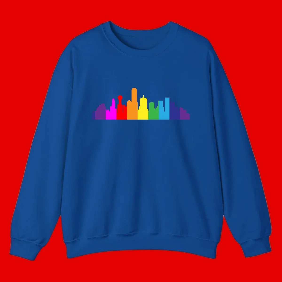 Colorful city skyline silhouette in rainbow pride colors transitioning from purple through red, orange, yellow, green, cyan and blue