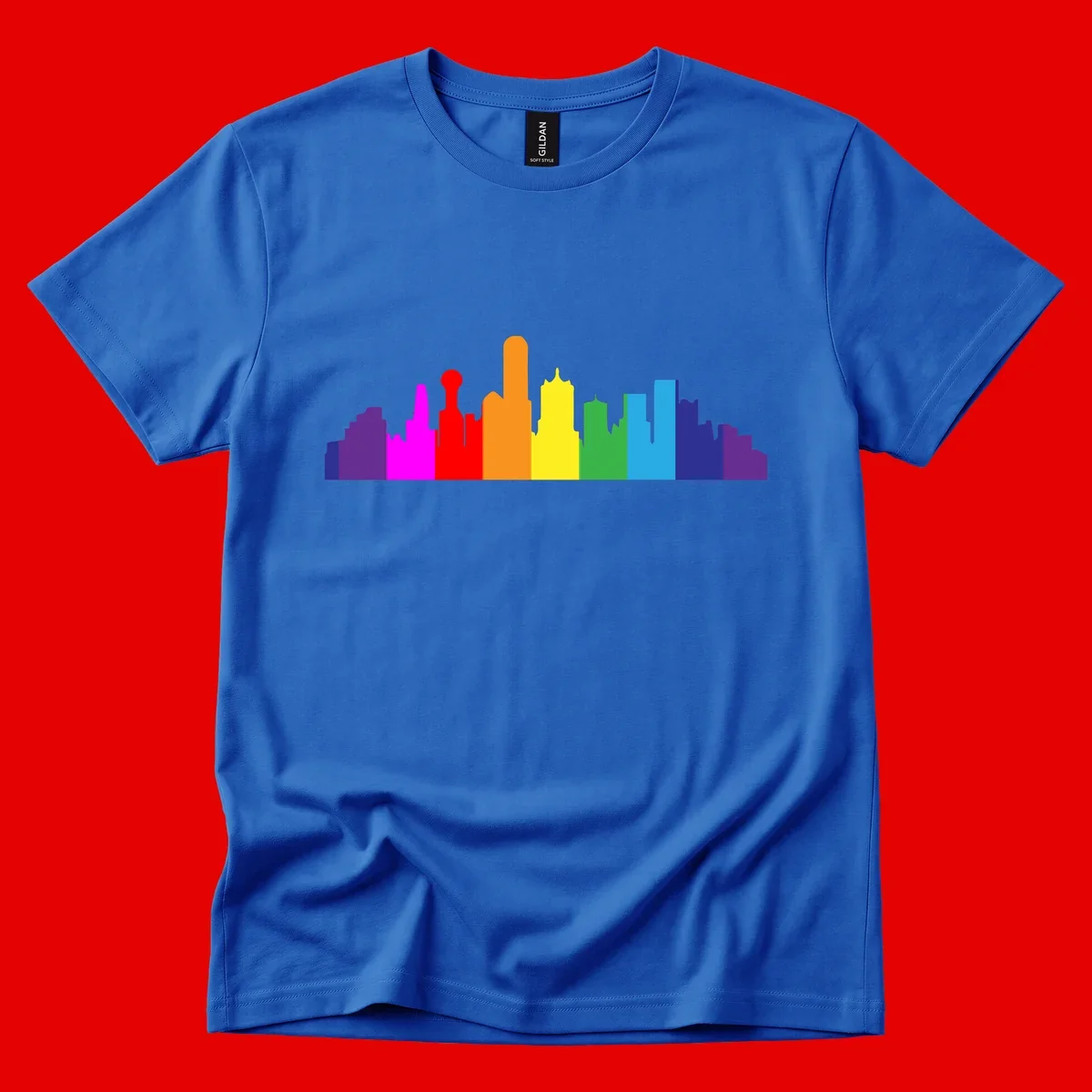 Colorful city skyline silhouette in rainbow pride colors transitioning from purple through red, orange, yellow, green, cyan and blue