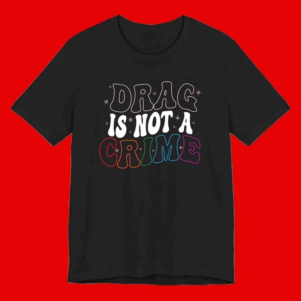 Drug is not a crime design with rainbow pride colored letters on gray background, promoting social justice and harm reduction advocacy