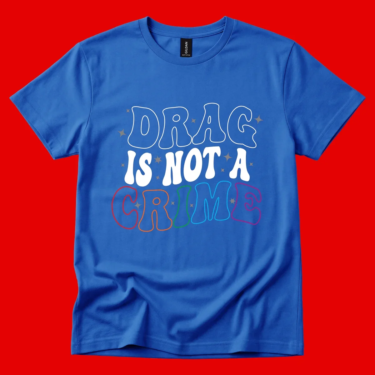Drug is not a crime design with rainbow pride colored letters on gray background, promoting social justice and harm reduction advocacy