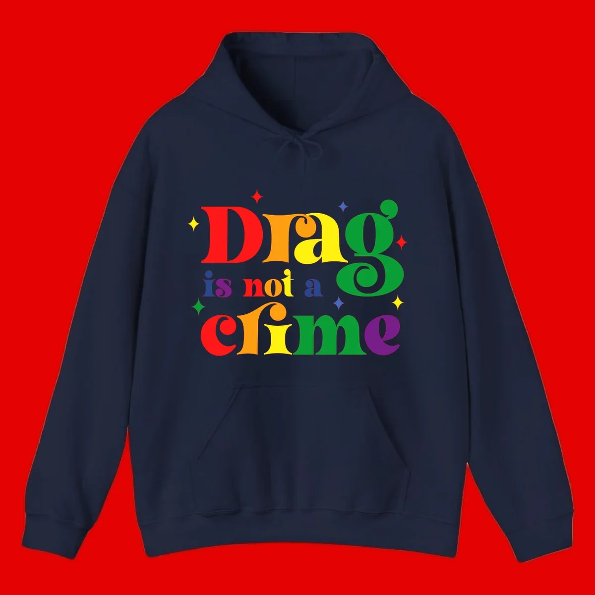 Rainbow gradient text reading 'Drag is not a crime' with colorful stars on gray background
