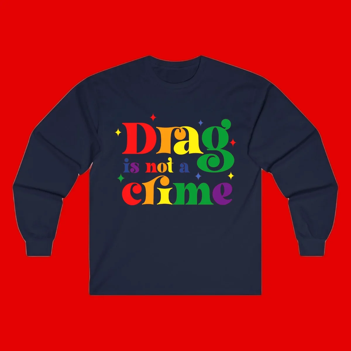 Rainbow gradient text reading 'Drag is not a crime' with colorful stars on gray background