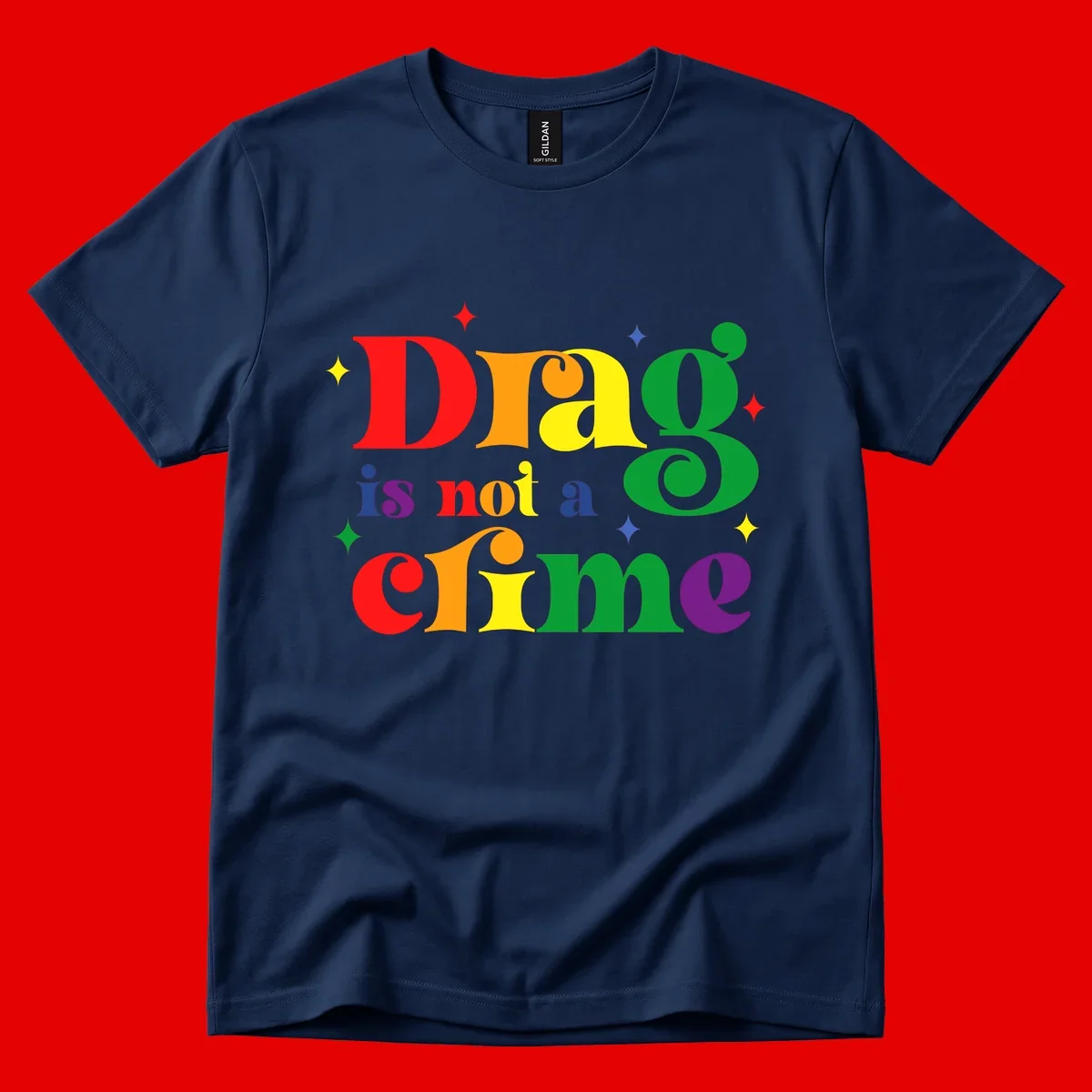 Rainbow gradient text reading 'Drag is not a crime' with colorful stars on gray background