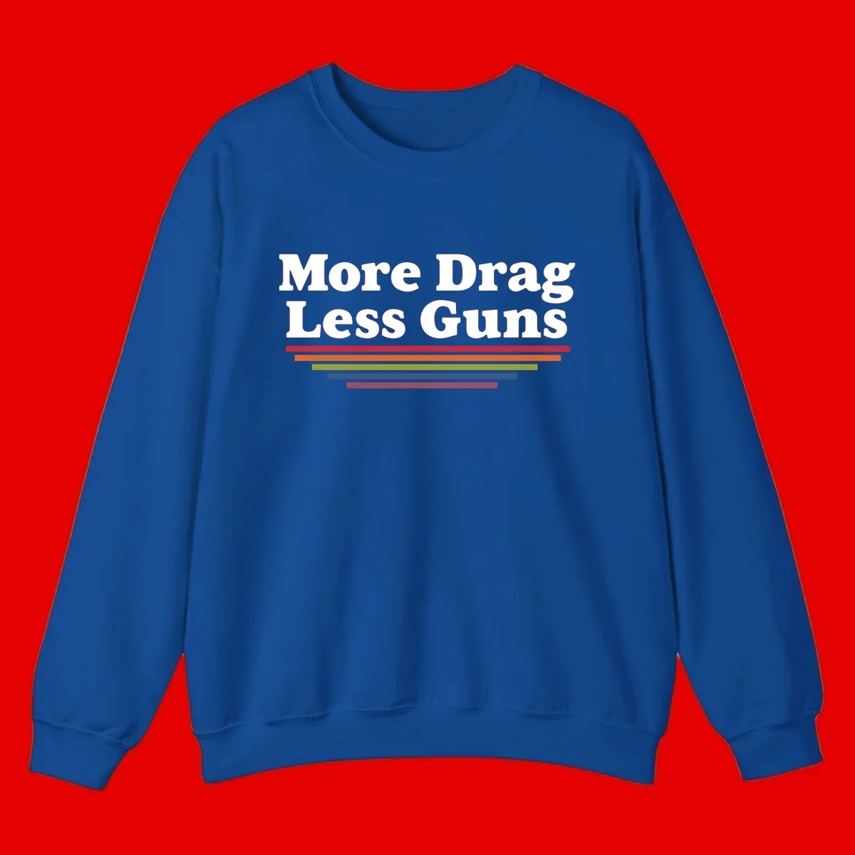 Bold white text reading 'More Drag Less Guns' with colorful horizontal bars below on gray background